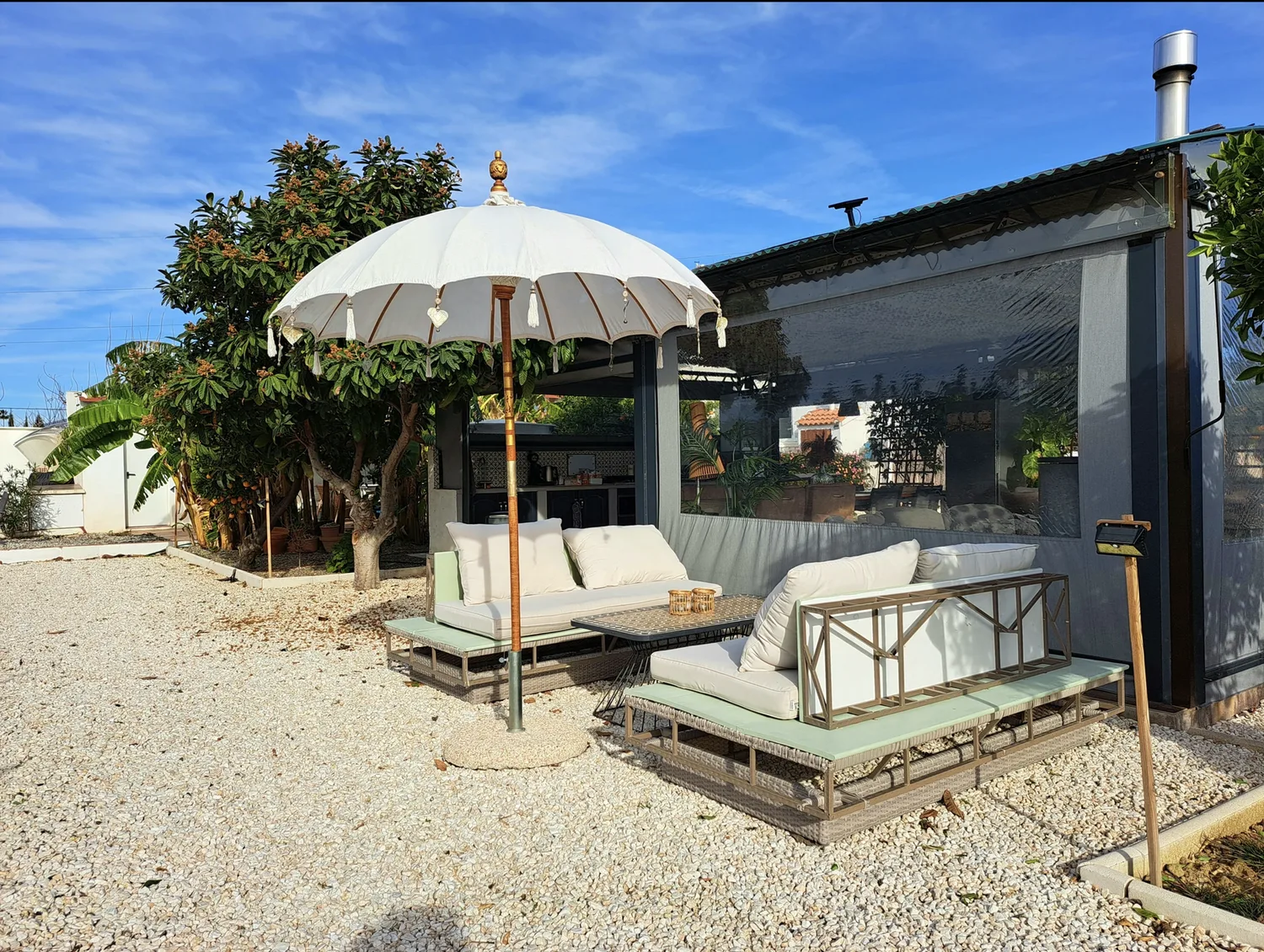 Lounge set with parasol in the garden